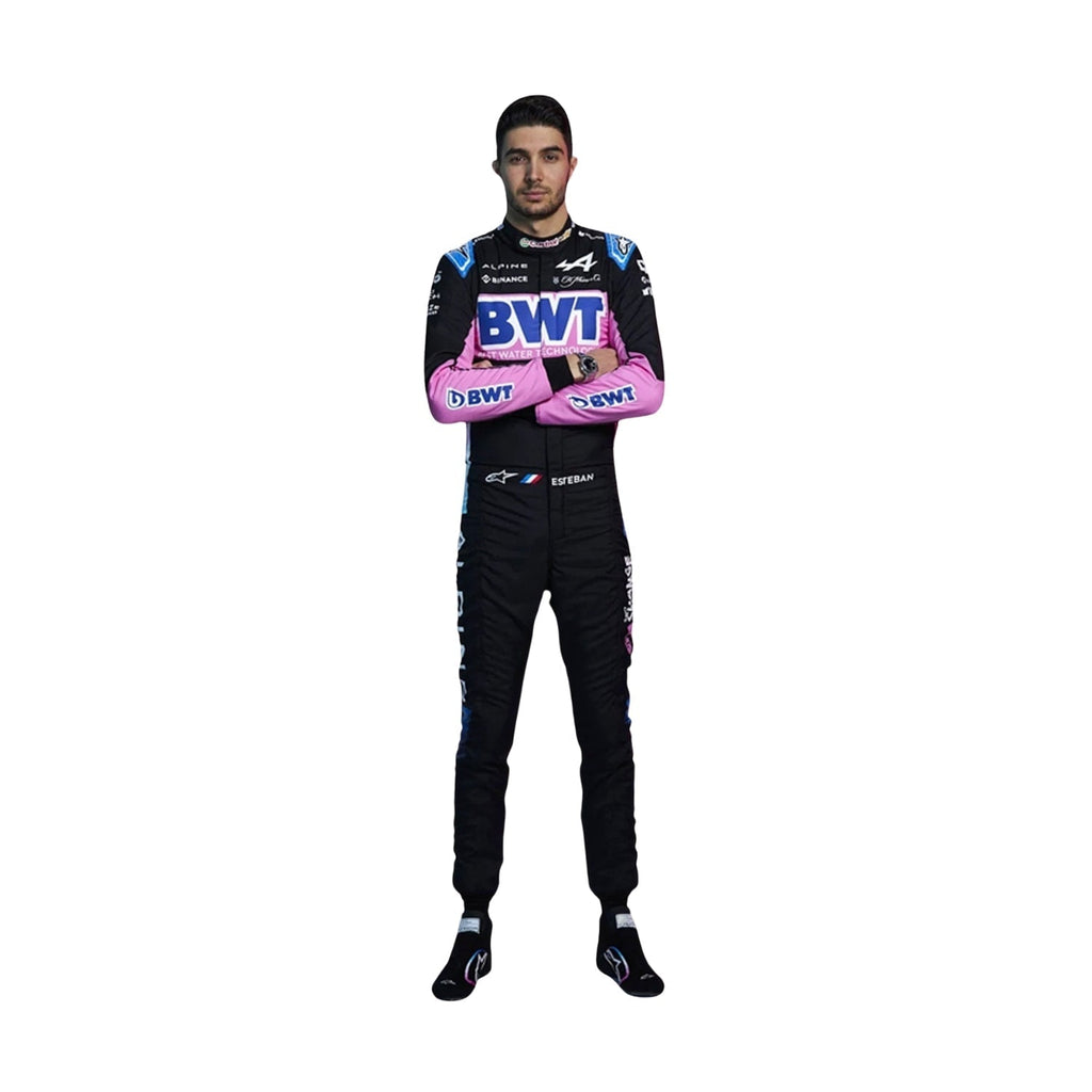Front view of Esteban Ocon's 2024 F1 racing suit in black with pink and blue accents, showcasing a modern design with sponsor logos.