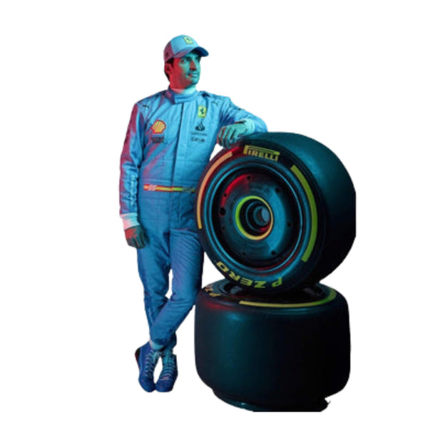 Front view of Carlos Sainz Jr’s 2024 Miami GP F1 racing suit in striking light blue with navy blue side panels and yellow accent branding.

