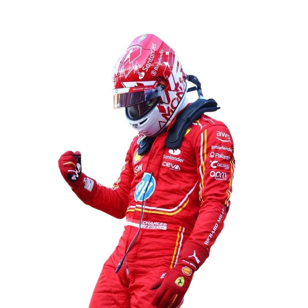 Close-up of Charles Leclerc's 2024 Monaco GP race suit, displaying the intricate red material with yellow stitching and sponsor logos.
