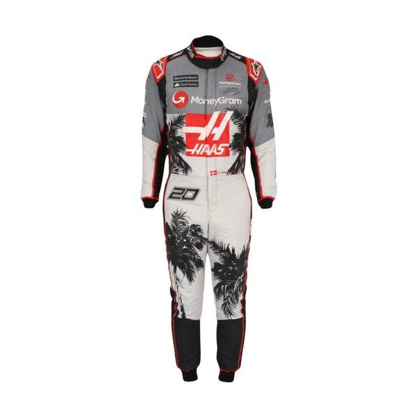 Kevin Magnussen's 2023 Miami Grand Prix F1 racing suit, front view: navy blue base with red and white accents, featuring a prominent star design on the leg and subtle stripes in the background.