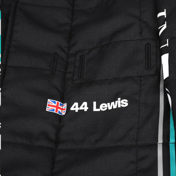 Close-up of Hamilton’s 2023 F1 suit detailing the fabric texture and fine stitching, with clear sponsor placements.
