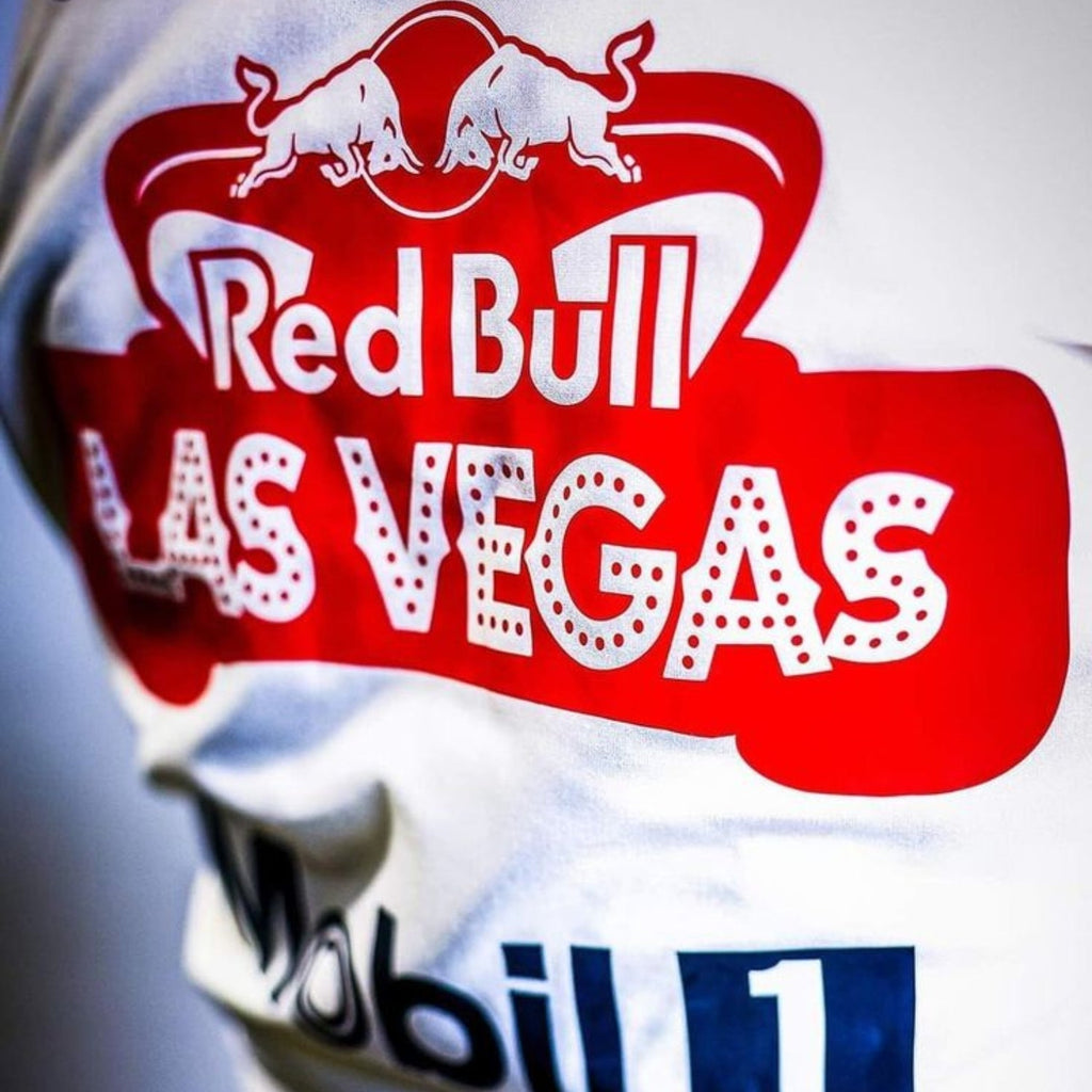 Rear view highlighting the white fabric with a vertical line of gold stars, red side stripes, and the iconic Elvis-inspired belt design.