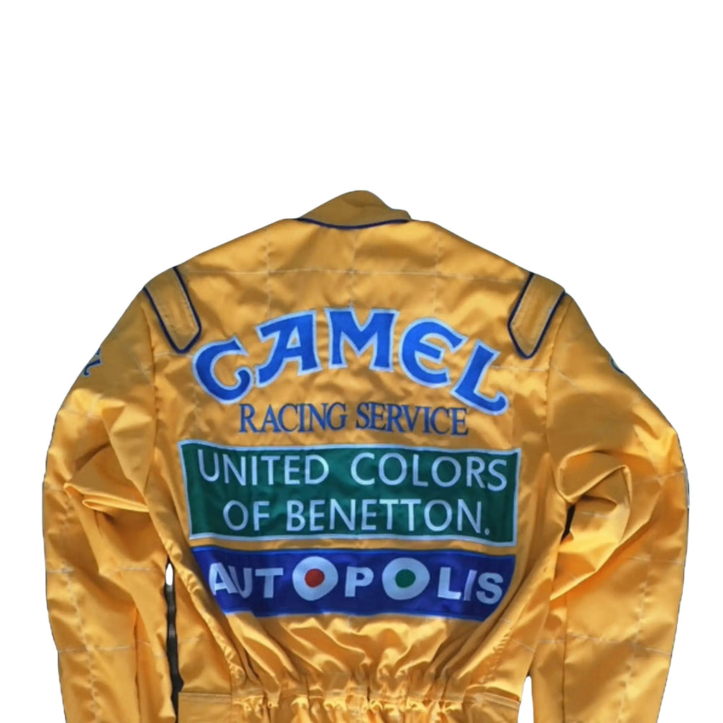 Back side of the 1992 Formula 1 suit worn by Michael Schumacher, showcasing era-specific sponsor logos and reinforced fabric seams for safety.