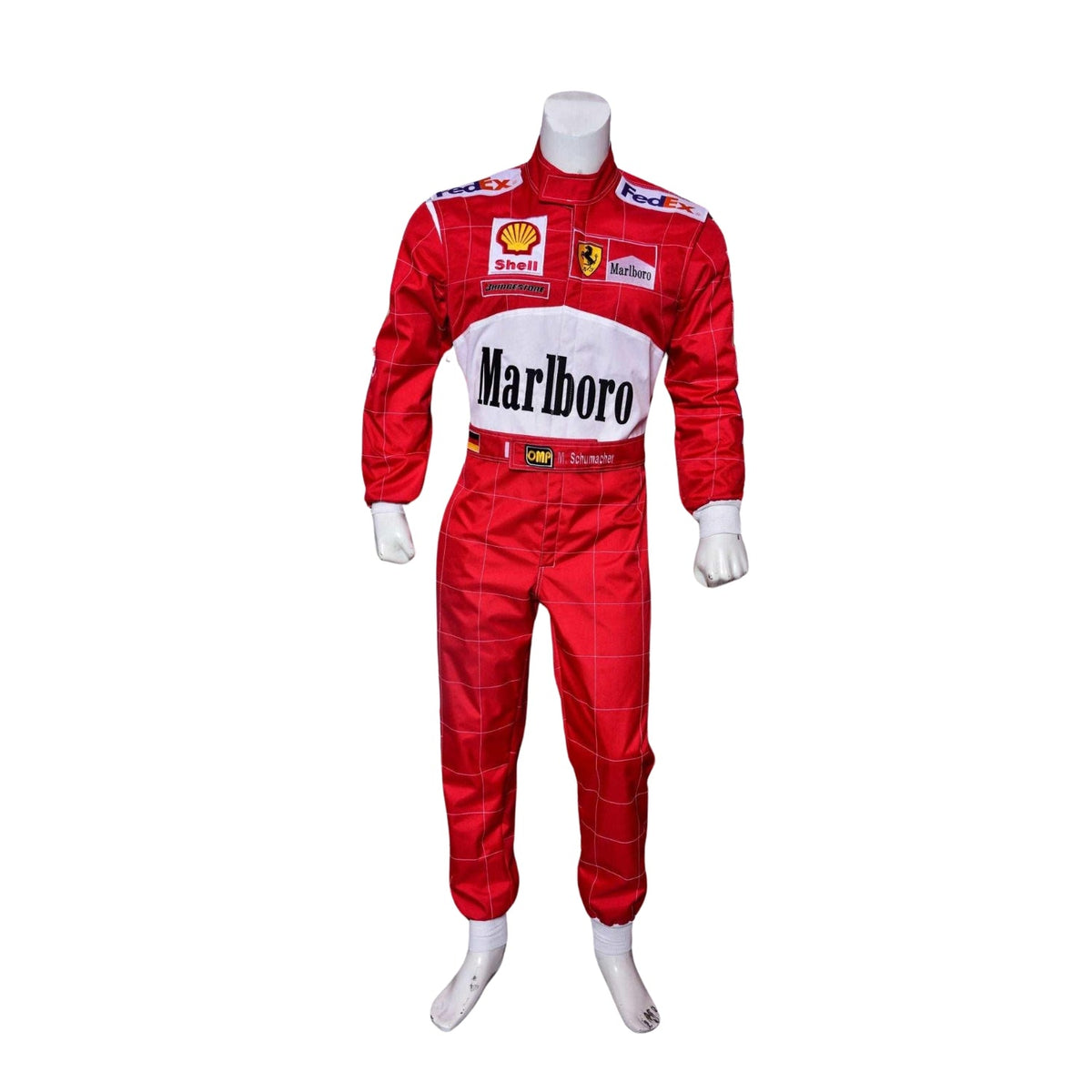 Front view of Michael Schumacher’s 2000 F1 race suit, featuring Ferrari red with white accents and sponsor logos that define his first world championship with the team. Main image