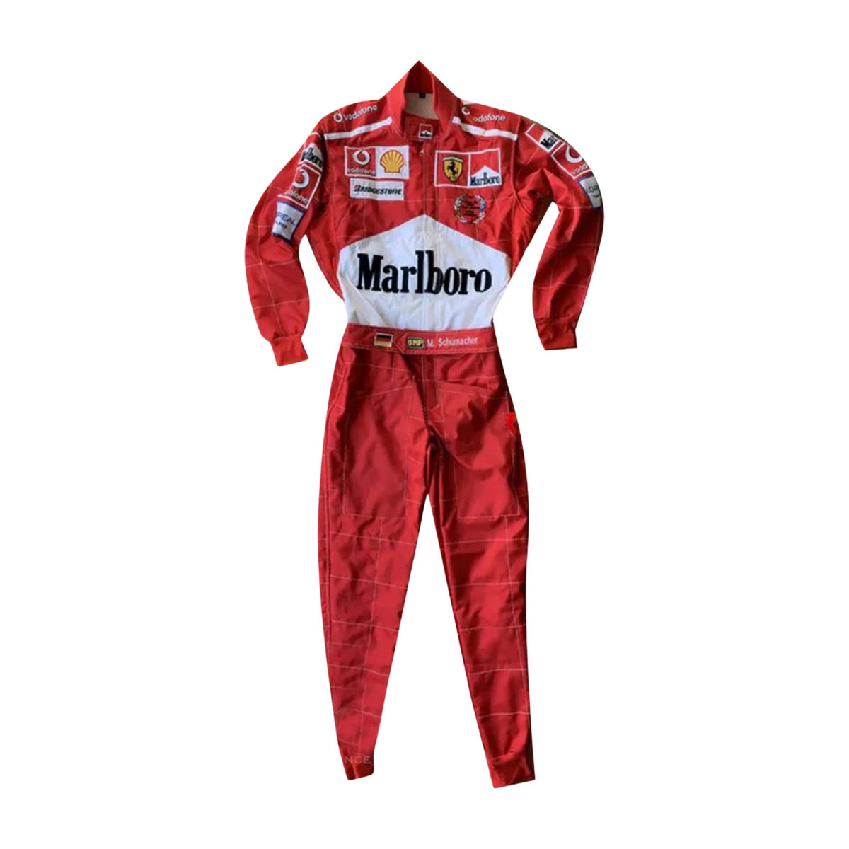 Front view of Michael Schumacher’s 2005 F1 racing suit in signature Ferrari red, with intricate white embroidery and sponsor detailing from the 2005 season. Main image
