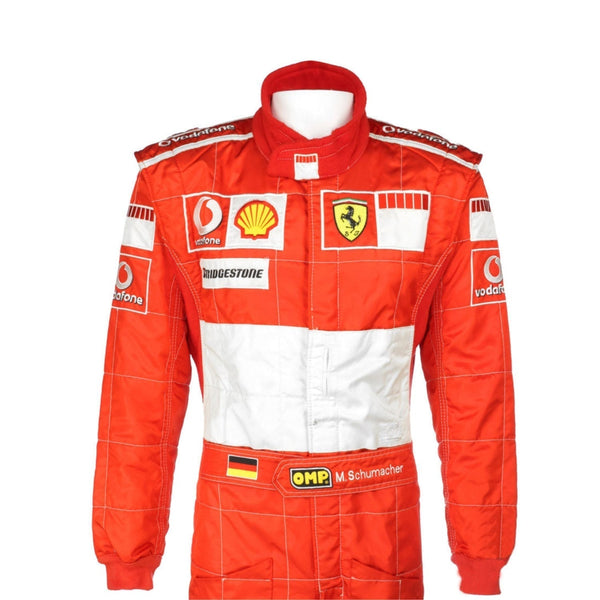 Close-up shot of Schumacher’s 2006 race suit, highlighting the detailed stitching, premium red material, and signature white branding elements.