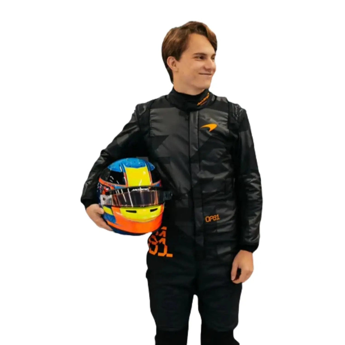 Front view of the 2025 McLaren F1 livery reveal racing costume worn by  Oscar Piastri, featuring a sleek matte black base with bold orange logos and driver initials (OP81) in neon orange. Main image