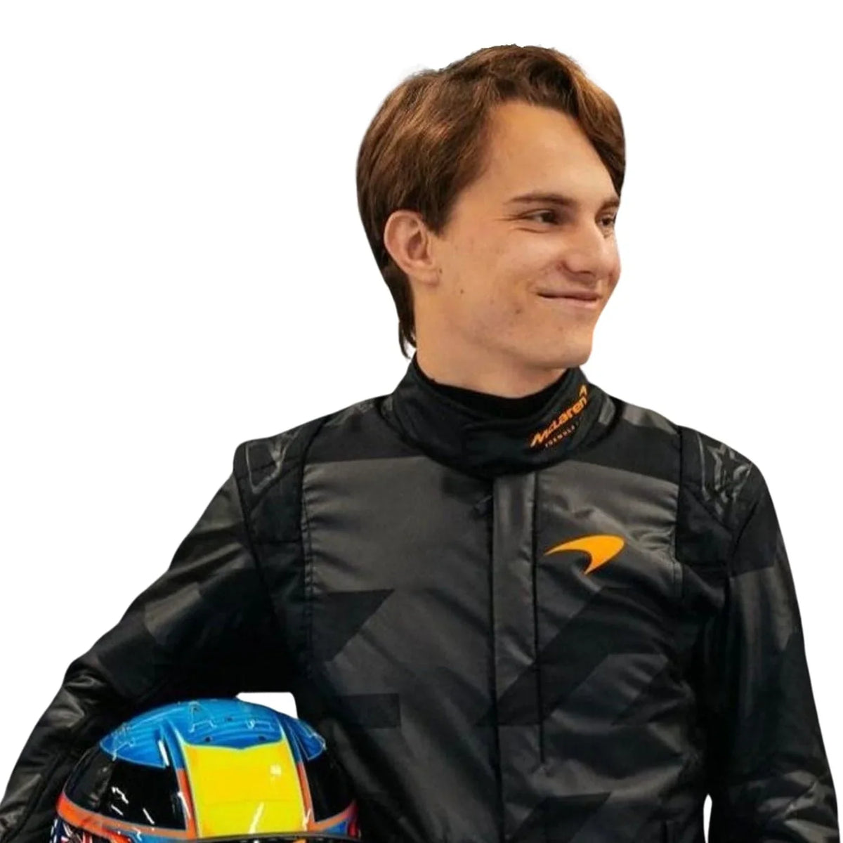 Close-up of  Piastri holding custom-designed helmets — Piastri with a high-gloss blue-yellow-red helmet—contrasting the matte black suit.