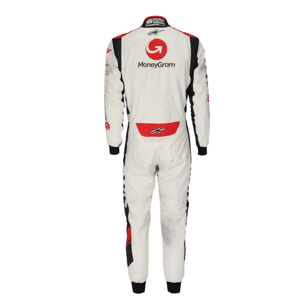 Back view of Kevin Magnussen’s 2017 signed F1 racing suit, highlighting sponsor embroidery and aerodynamic design for Formula 1 racing.
