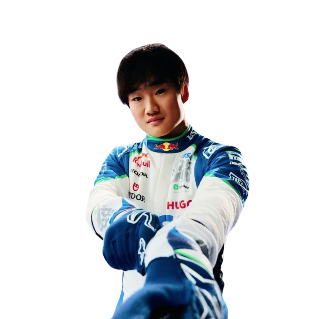 Close-up of Yuki Tsunoda's 2025 F1 race suit, displaying the intricate white fabric with blue and green accents and detailed sponsor logos.